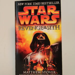 An image of Star Wars: Revenge of the Sith with its front cover displaying a giant Darth Vader standing over a lightsaber duel of Anakin Skywalker and Obi-Wan Kenobi